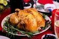 Baked turkey. Christmas dinner. The Christmas table is served with a turkey, decorated with bright tinsel and candles. Fried Royalty Free Stock Photo