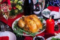 Baked turkey. Christmas dinner. The Christmas table is served with a turkey, decorated with bright tinsel and candles. Fried Royalty Free Stock Photo