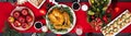 Baked turkey. Christmas dinner. The Christmas table is served with a turkey, decorated with bright tinsel and candles. Fried Royalty Free Stock Photo