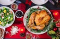 Baked turkey. Christmas dinner. The Christmas table is served with a turkey, decorated with bright tinsel and candles. Fried Royalty Free Stock Photo