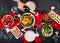 Baked turkey. Christmas dinner. The Christmas table is served with a turkey, decorated with bright tinsel and candles. Fried Royalty Free Stock Photo