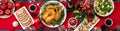 Baked turkey. Christmas dinner. The Christmas table is served with a turkey, decorated with bright tinsel and candles. Fried Royalty Free Stock Photo