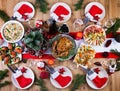 Christmas dinner. The Christmas table is served with a turkey, decorated with bright tinsel and candles. Royalty Free Stock Photo