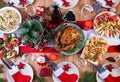 Christmas dinner. The Christmas table is served with a turkey, decorated with bright tinsel and candles. Fried chicken, table. Royalty Free Stock Photo