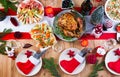 Christmas dinner. The Christmas table is served with a turkey, decorated with bright tinsel and candles. Fried chicken, table. Royalty Free Stock Photo