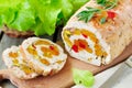 Baked turkey roll stuffed with dried apricots, cherries and pistachios