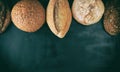 baked various loaves of bread on a black background