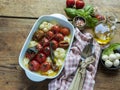 Baked vegetable tomato, basil, mozzarella cheese, garlic in the oven in ceramic dishes. cooking, cooked dish