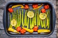 Baked vegetables: asparagus, cherry tomatoespaprika, lemon