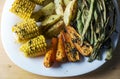 Baked vegetables - green beans, carrots, corn and potatoes Royalty Free Stock Photo