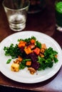 Baked vegetables, walnuts and kale salad Royalty Free Stock Photo