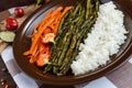 Baked vegetables (asparagus beans and carrot), boiled rice and rye croutons. Royalty Free Stock Photo