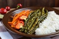 Baked vegetables (asparagus beans and carrot), boiled rice and rye croutons. Royalty Free Stock Photo