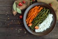 Baked vegetables (asparagus beans and carrot), boiled rice and rye croutons. Royalty Free Stock Photo