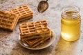 Baked waffles and organic sweet honey for breakfast Royalty Free Stock Photo