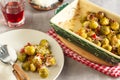 Baked warm salad of brussels sprouts with bacon, red onion and parmesan cheese Royalty Free Stock Photo