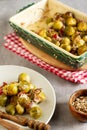 Baked warm salad of brussels sprouts with bacon, red onion and parmesan cheese Royalty Free Stock Photo
