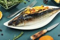 Baked whole fish grilled on a plate