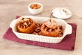 Baked winter apples with raisins, almonds and honey