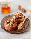 Baked winter apples with raisins, almonds and honey