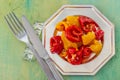 Baked yellow red peppers on a silver plate. Royalty Free Stock Photo