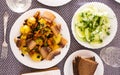 Traditional rustic dish. fried potatoes with chanterelle mushrooms and pork brisket with herbs. top view Royalty Free Stock Photo