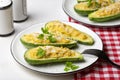 Baked Zucchini boats stuffed with ricotta cheese and tuna fish Royalty Free Stock Photo