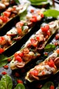 Baked zucchini boats stuffed with vegetarian sausages and cheese Royalty Free Stock Photo