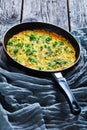 Baked zucchini frittata on a frying pan Royalty Free Stock Photo