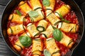 Baked zucchini rolls with ricotta, pecorino cheese in marinara sauce. Healthy food Royalty Free Stock Photo