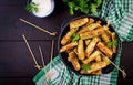 Baked zucchini sticks with cheese and bread crumbs. Vegan food.