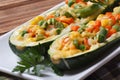 Baked zucchini stuffed with vegetables closeup