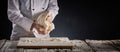 Baker of chef kneading a large portion of dough