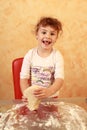 Happy baker child baking cookies