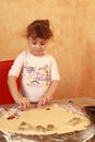 Baker child baking cookies