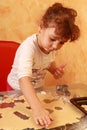 Baker child baking cookies