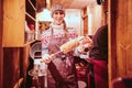 Baker on the Christmas market selling sweet cakes