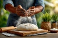 Baker claps hands, creating flour cloud over round dough with vintage tone. Bright kitchen bathed in sunlight. Concept Royalty Free Stock Photo