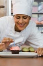 Baker with cupcake and candle Royalty Free Stock Photo