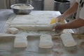 Baker Cutting Raw Ciabatta Bread Dough Royalty Free Stock Photo