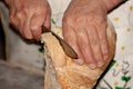 Baker cutting slices of bread