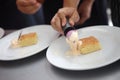 Baker decorating the delicious pastry cake