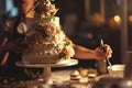 A baker decorating an elaborate wedding cake, AI generated Royalty Free Stock Photo