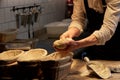 Baker with dough rising in baskets at bakery Royalty Free Stock Photo