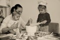 Baker family, Mum with two kids in the kitchen Royalty Free Stock Photo