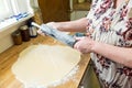 Baker flouring a rolling pin to prep for sugar cookie dough Royalty Free Stock Photo