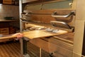 Baker hand putting dough into bread oven at bakery Royalty Free Stock Photo