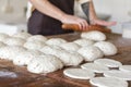Fresh rolled dough at bakery house baking sheet pan wooden table with flour bread