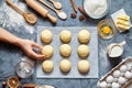 Baker hands preparing dough for buns recipe ingridients food flat lay