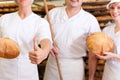 Baker with his team in bakery Royalty Free Stock Photo